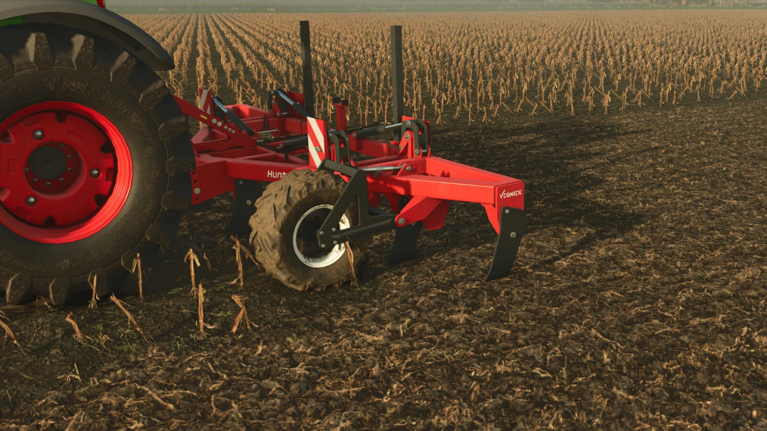 Farming Simulator 25 mod: Vegniek Hunter 600 v1.0.0.0 in a harvested field with crop stubble, ready for farming tasks.