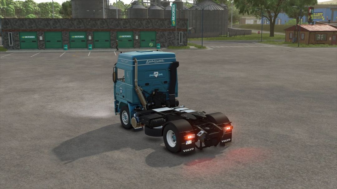 Farming Simulator 25 mods featuring a blue Volvo F16 Globetrotter Dolphin Edition truck in a parking lot.