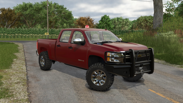 fs25-mods,  Farming Simulator 25 mod: Red pickup truck with a black front guard, stop sign on top, parked on rural road among green fields and trees.