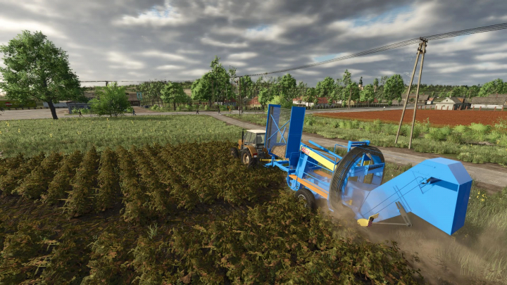 fs25-mods, Farming Simulator 25 mod: Blue Agromet Z644 Anna harvester working in a field during daytime