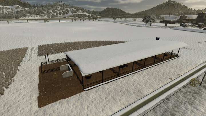 fs25-mods,  Snow-covered cattle shelter in a farming field, part of FS25 mods for Farming Simulator 25.