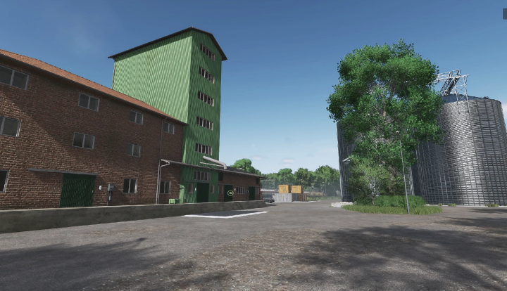 fs25-mods, Farming Simulator 25 mods: Scenic farmyard with brick and green silos, large trees, and storage tanks in FS25 mod version Harz und Heide v1.0.0.0.