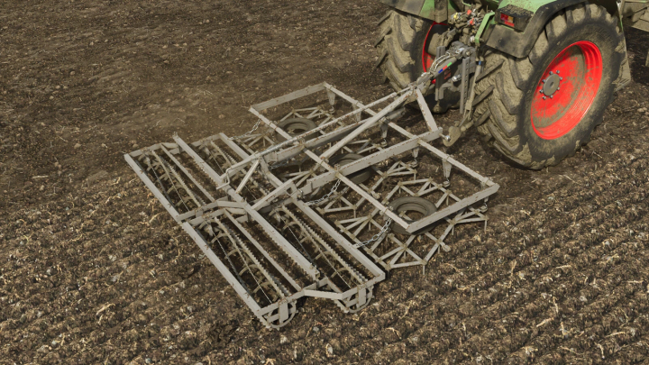 fs25-mods, Farming Simulator 25 mod: Unia Heavy Harrow v1.0.0.0 attached to tractor for soil preparation in Farming Simulator 25.