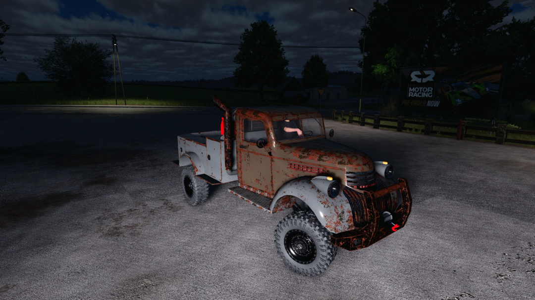 Rusty 1941 Chevy welding truck mod from Farming Simulator 25, shown parked at night on a gravel surface with a driver inside.