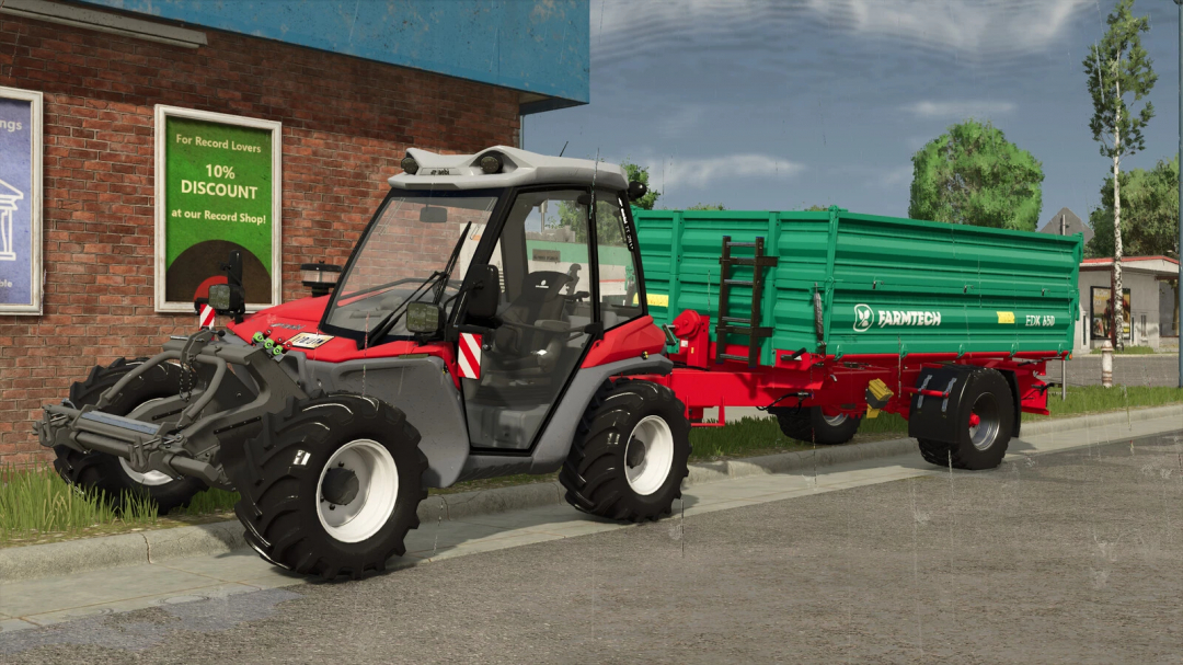 FS25 mod featuring a red and gray AEBI TT 281+ tractor with a green FARMTECH trailer, parked on a city street.