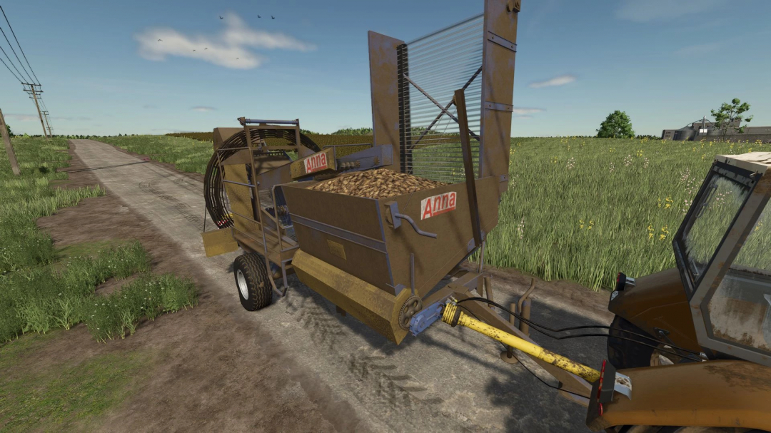Farming Simulator 25 mod: Agromet Z644 Anna v1.0.0.0, a grain harvesting machine attached to a tractor on a rural dirt road.