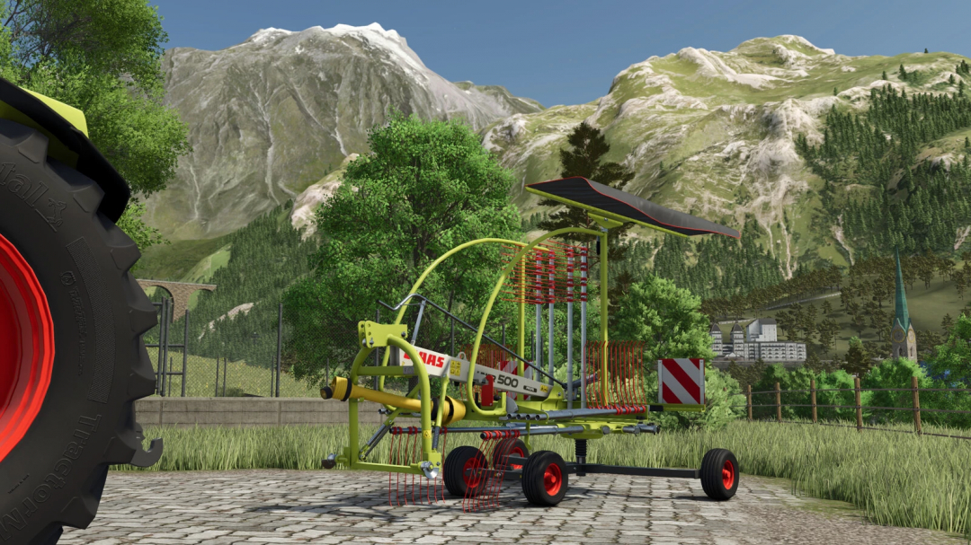 Farming Simulator 25 mod: CLAAS LINER 500 Profi L hay rake attachment on a farm background with mountains.