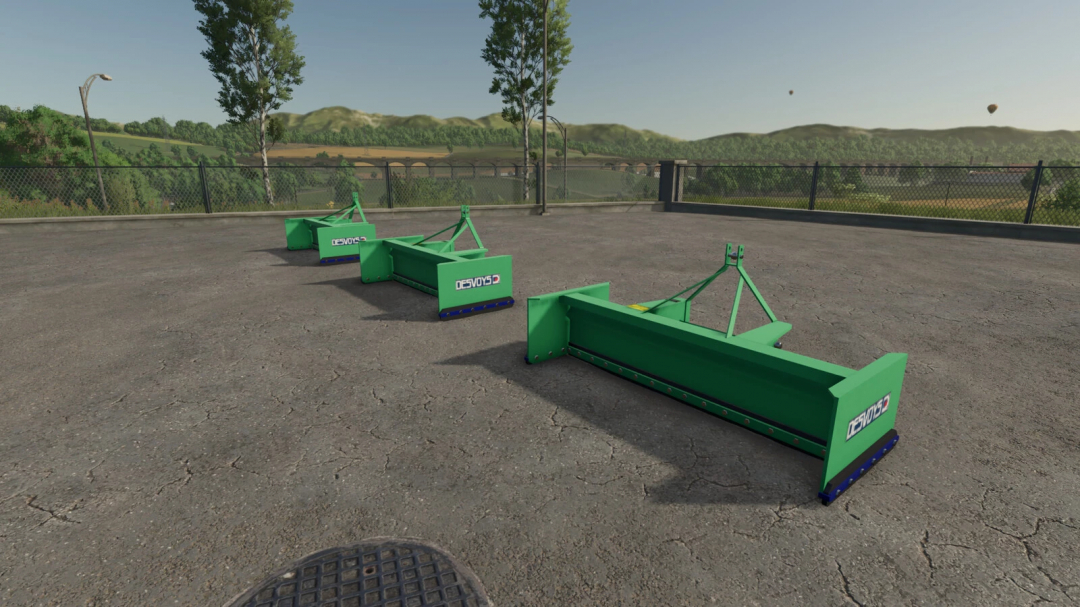 FS25 mods: Desvoys Junior Pack v1.0.0.0 in Farming Simulator 25, featuring three green soil cultivation tools on a concrete surface.