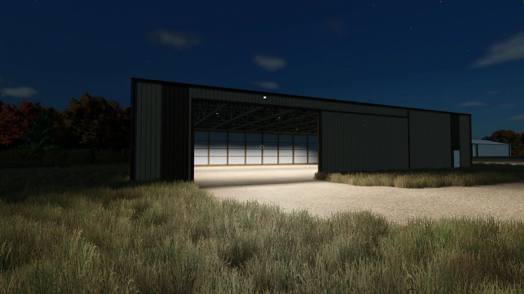 Night view of the FS25 80x100 Cold Storage mod in Farming Simulator 25, illuminated with open doors, surrounded by grass and trees.