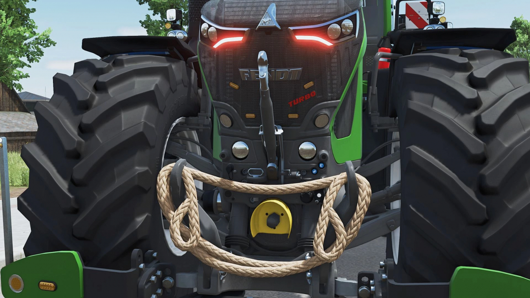 Close-up of the front of a green Fendt tractor with large tires, detailed grill, hoses, and accessories from Farming Simulator 25 mods.