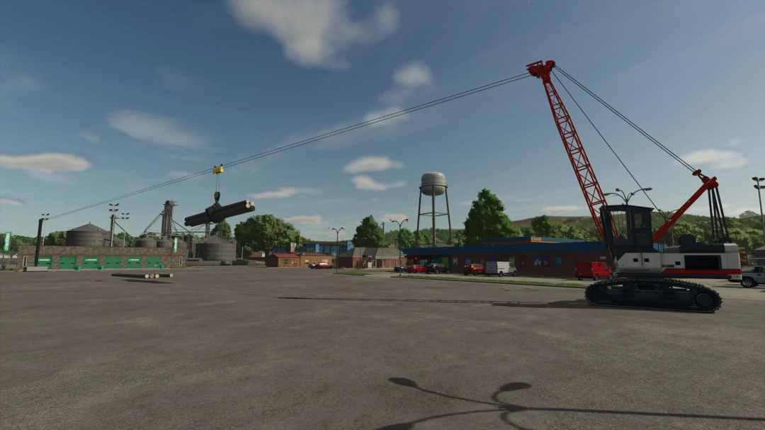 Farming Simulator 25 mod: Caterpillar crane lifting logs with grapple yarder in a parking lot.