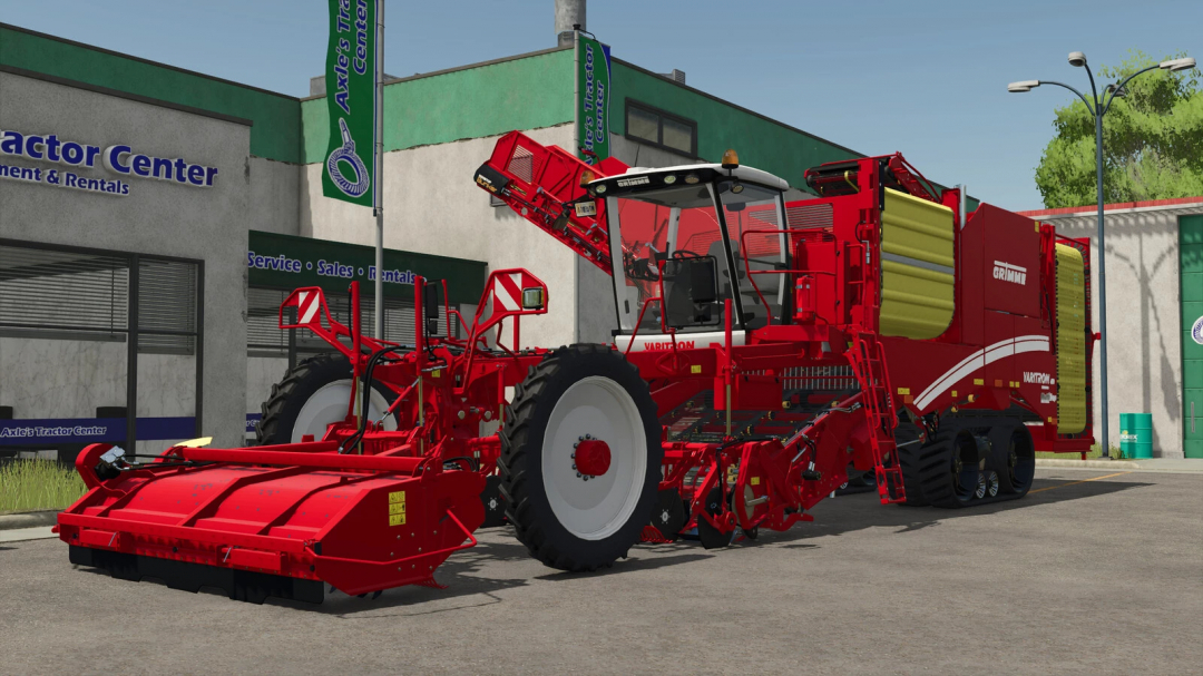 Farming Simulator 25 mod: Grimme Varitron 470 Platinum Terra Trac, a red agricultural machine with yellow components, parked outside a tractor center.