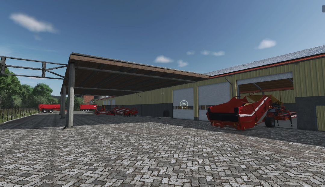 Farming Simulator 25 mod: barn with farming machinery including red equipment, storage area, and open garage doors under a blue sky.