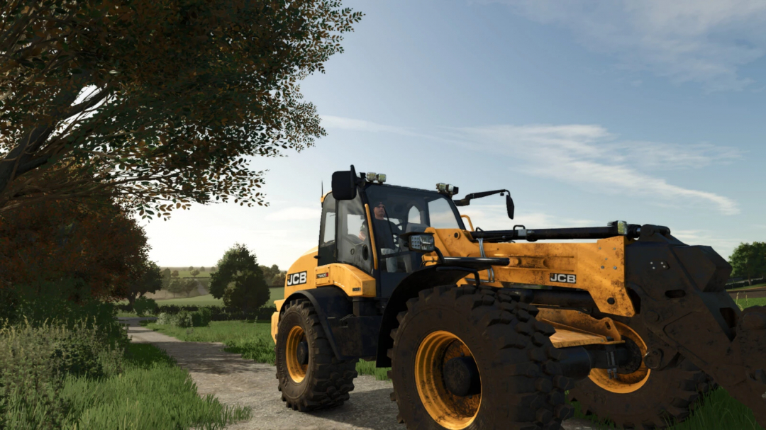 FS25 mods: JCB TM 420S wheel loader on a rural dirt trail, realistic Farming Simulator 25 mod.