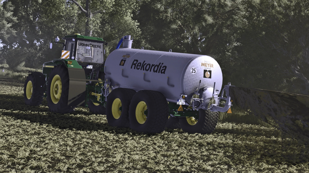Farming Simulator 25 mod showing a John Deere tractor with a Rekordia tanker, realistic agricultural equipment in a forest setting.