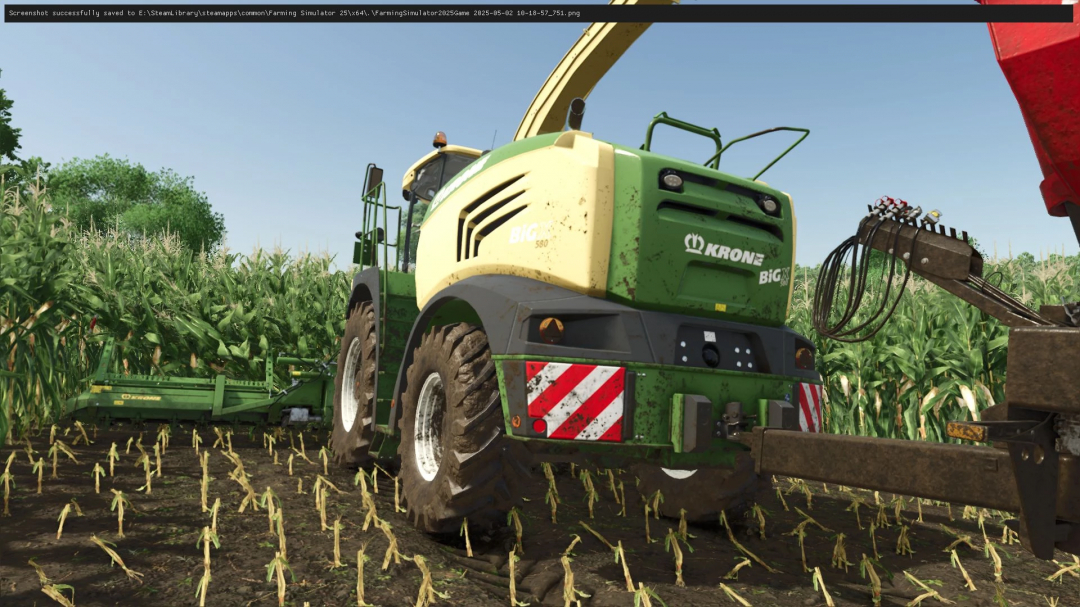 Farming Simulator 25 mod featuring the Krone BigX 580 forage harvester working in a cornfield.