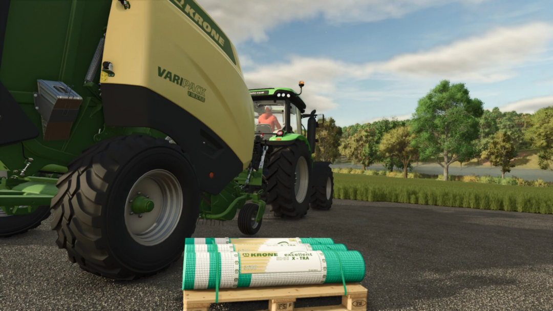 Farming Simulator 25 mod: Krone Consumables v1.0.0.0, green tractor with fertilizer spreader and rolled fertilizer pallets on a farm road.