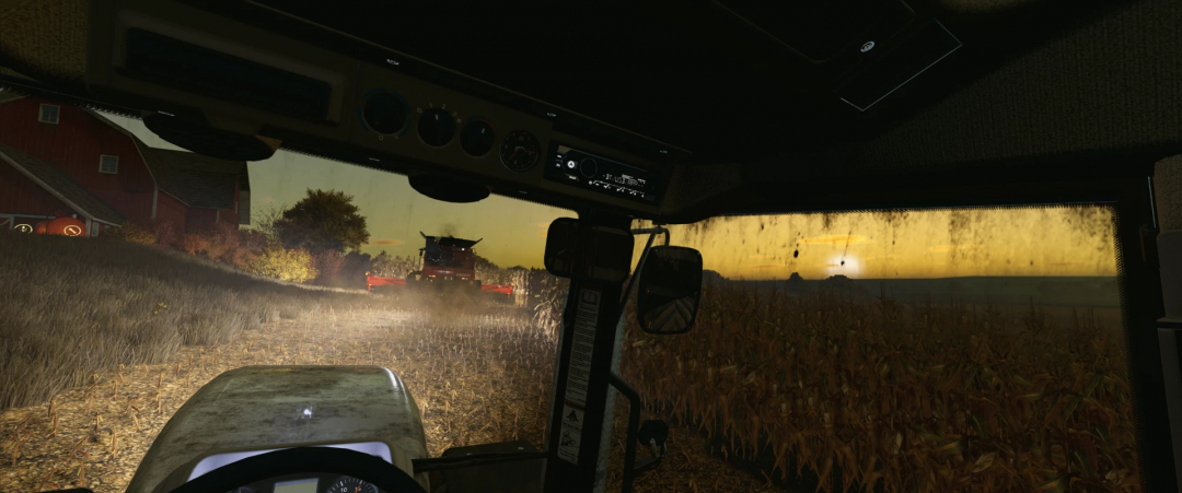 Inside view of a tractor cab in Farming Simulator 25 with a Monteith RCR mod, showing crop fields at sunset.