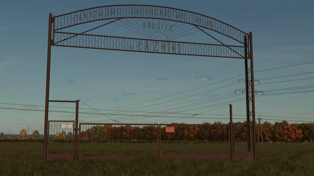 Farming Simulator 25 mod: Rusty gate and fence with PGR Buildings v1.0.0.0 sign, realistic rural farm scenery.