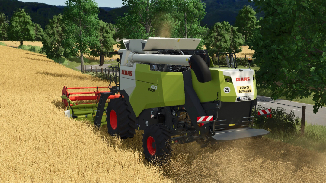 Farming Simulator 25 mods: CLAAS Evion 410-450 Series forage harvester working in a wheat field.
