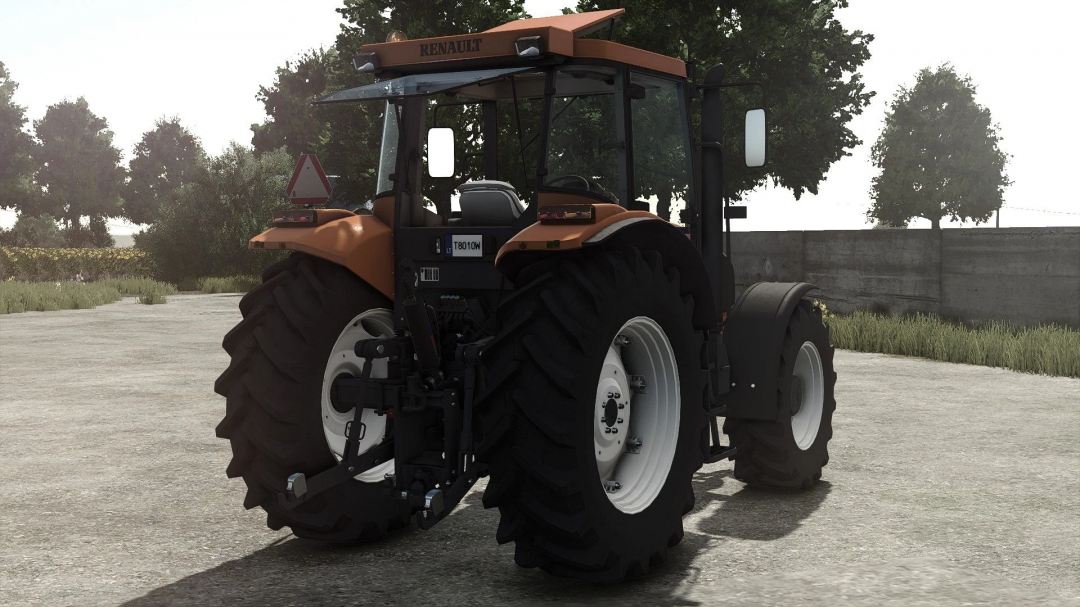 Farming Simulator 25 mod: Renault Ares 600 tractor with large tires, parked on a farm.