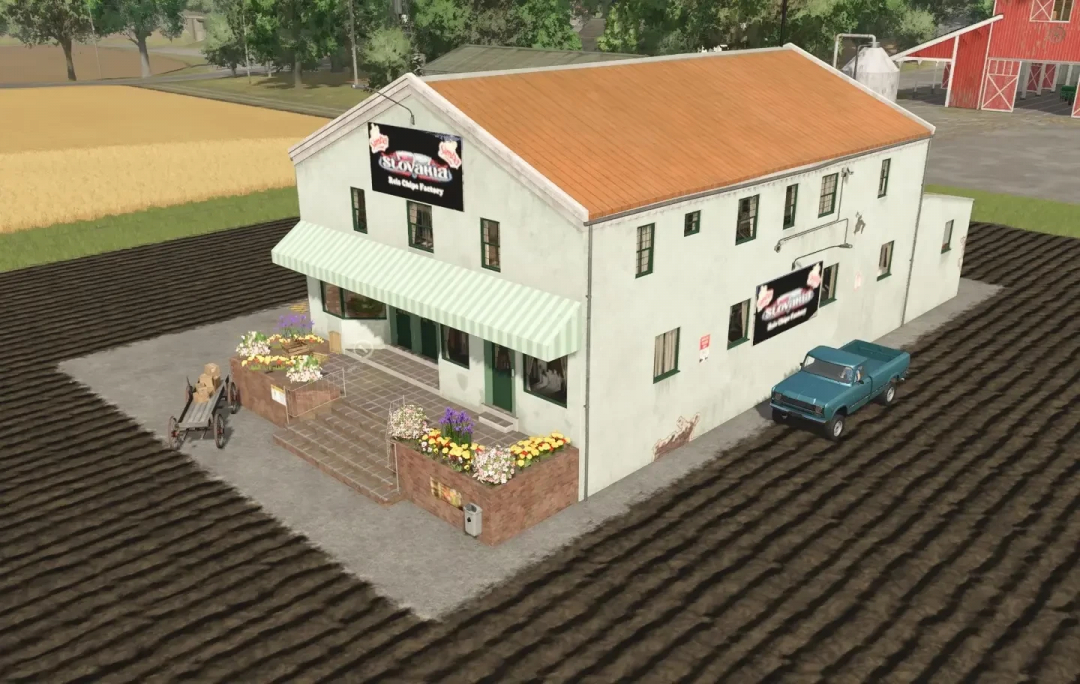 Farmhouse with a rice chips factory sign, surrounded by flower planters, a vintage cart, and a classic blue truck in Farming Simulator 25 mods.