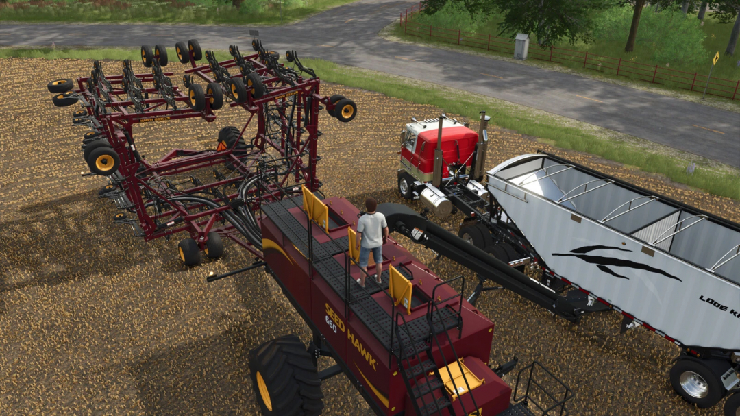Farming Simulator 25 mod: Seed Hawk Pack v1.0.0.2 featuring large seeder and grain trailer for realistic farming. FS25 mods for immersive gameplay.