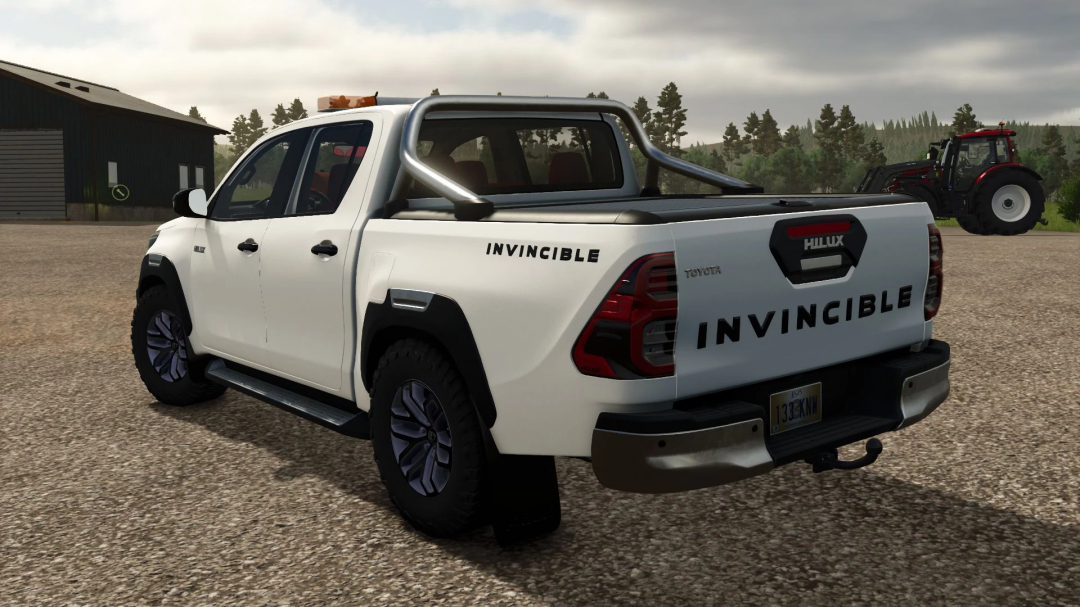 FS25 mod: White Toyota Hilux 2021 with Invincible decals, off-road tires, and a rugged truck bed for Farming Simulator 25.