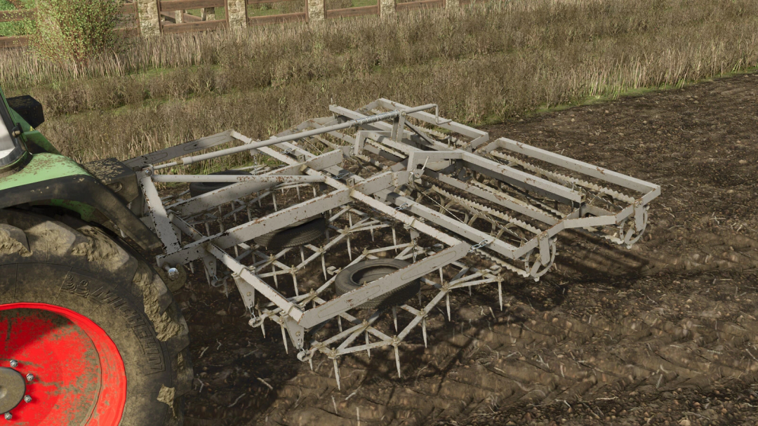 Farming Simulator 25 mod: Unia Heavy Harrow attached to a tractor, used for soil cultivation in Farming Simulator 25.