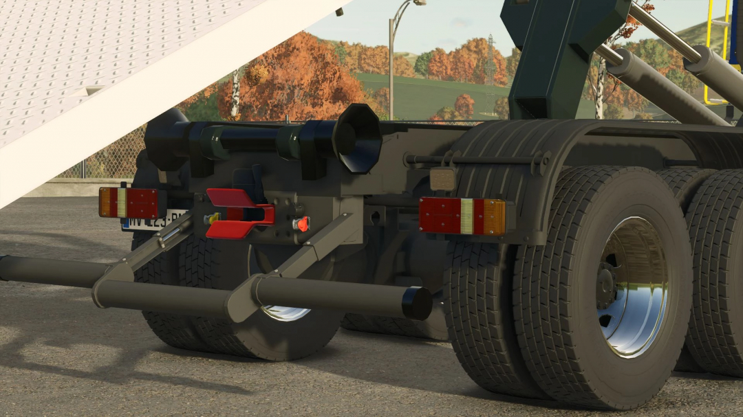 Detailed view of the rear of a Volvo FMX Ampiroll 8x4 truck mod in Farming Simulator 25, showing tires, lights, and attachment points.