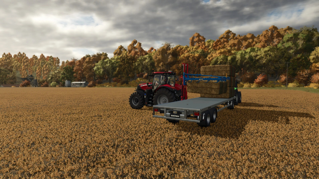 Farming Simulator 25 mod showing a tractor with a flatbed trailer carrying hay bales, set in a field with autumn trees and cloudy sky.