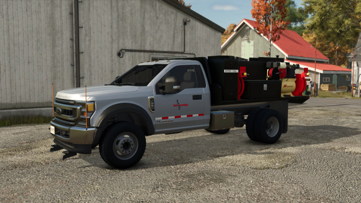 fs25-mods,  Farming Simulator 25 mod: 2020 Ford F550 fuel and lube truck with tanks and hoses, parked outdoors near farm buildings.