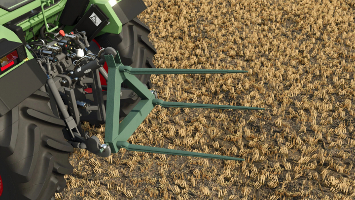 fs25-mods,  Close-up of a bale pitchfork pack mod in Farming Simulator 25, attached to a tractor, in a harvested field.