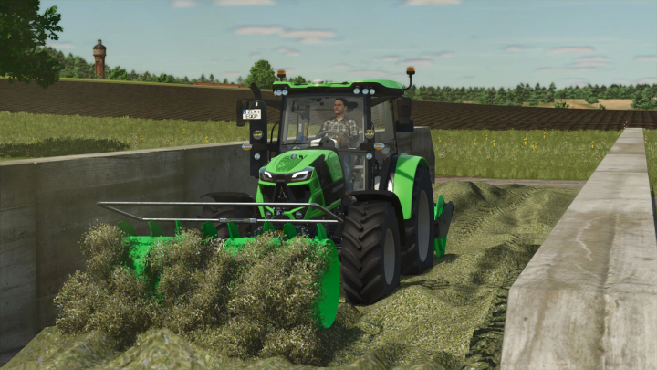 fs25-mods,  Farming Simulator 25 mod: green tractor using a sway blade for ground leveling, part of the BeTEC Silo Pack v1.0.0.1.