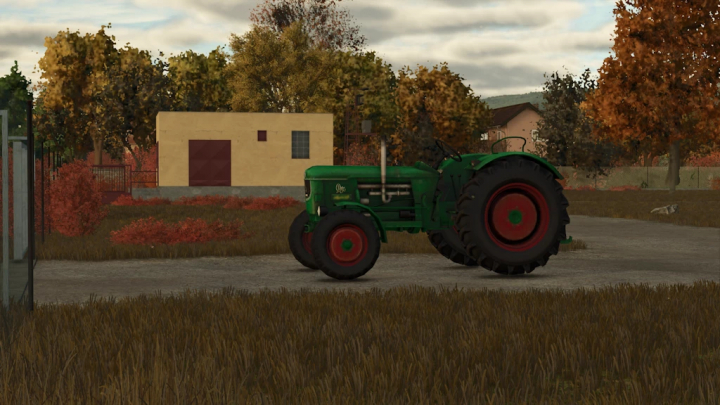 fs25-mods,  Farming Simulator 25 mod: a vintage green Deutz D80 tractor with red wheels, parked on a rural farmyard with autumn trees and a farmhouse in the background.