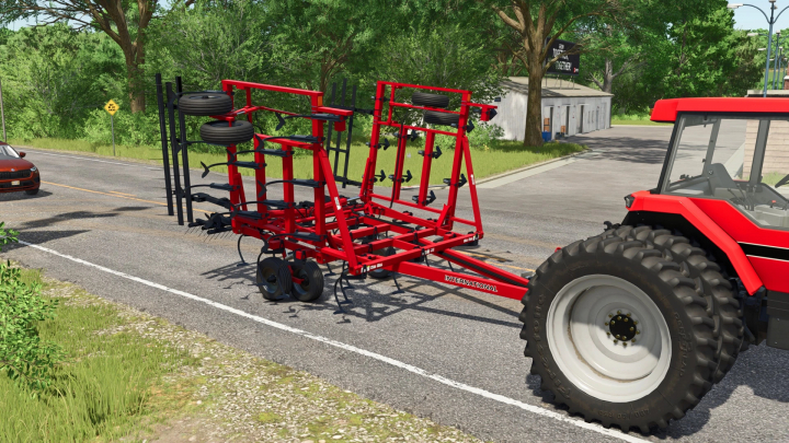 fs25-mods,  Farming Simulator 25 mod: red vibratory shank implement attached to a tractor, used for soil cultivation in FS25.