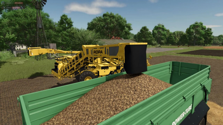 fs25-mods, Farming Simulator 25 mod: Ropa Maus 5 v1.0.0.0 harvesting machine working on a farm with a green trailer.