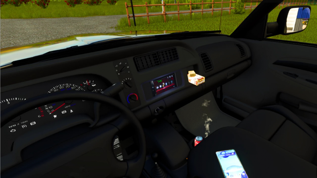 Inside view of a Farming Simulator 25 mod featuring a black vehicle dashboard with a phone, ashtray, and game interface visible, in Farming Simulator 25.