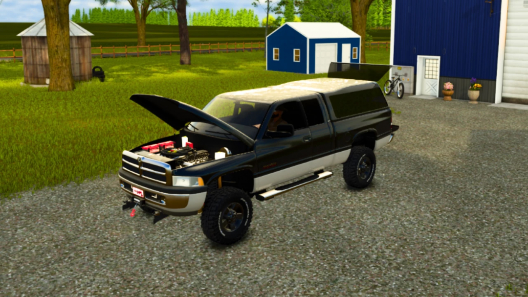 Farming Simulator 25 mod: 1999 Dodge Ram 2500 Club Cab with open hood, parked near a farm building in a green rural setting.