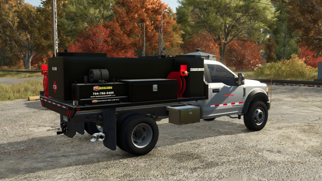 FS25 mod: Fuel and Lube truck with black tank, hoses, and equipment for Farming Simulator 25.