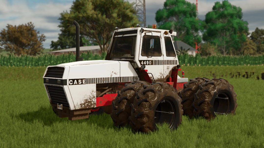 Farming Simulator 25 mod featuring a vintage Case IH Traction King series tractor with large muddy tires, set on a grassy field.