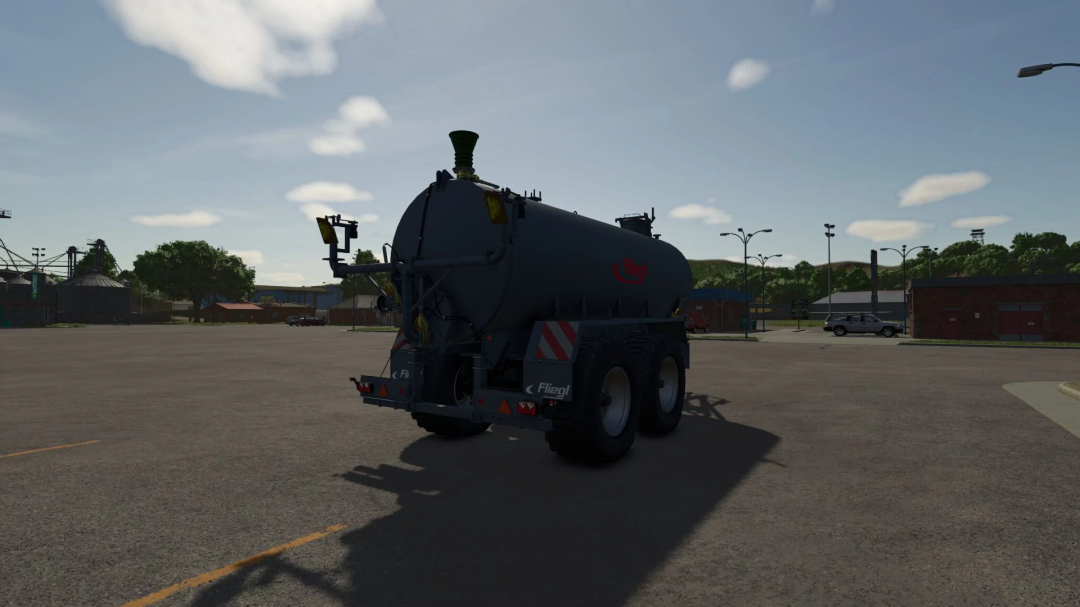 Farming Simulator 25 mod: Fliegl VFW 18000 tanker in a parking lot, with trees and buildings in the background.