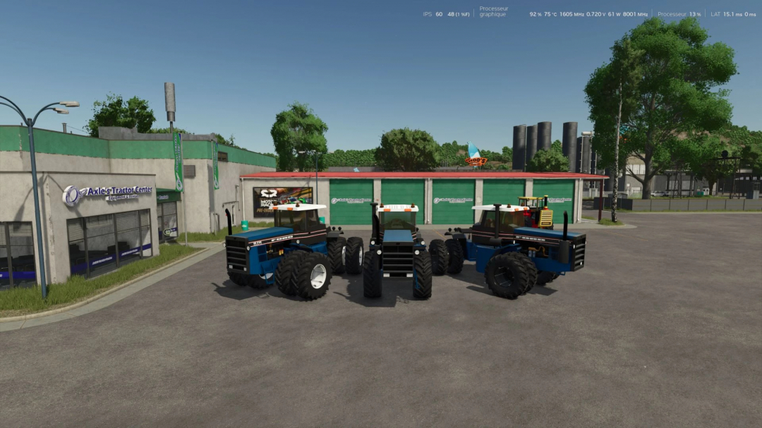 Three blue tractors parked outside Axle's Tractor Center in Farming Simulator 25 with clear skies and trees in the background.