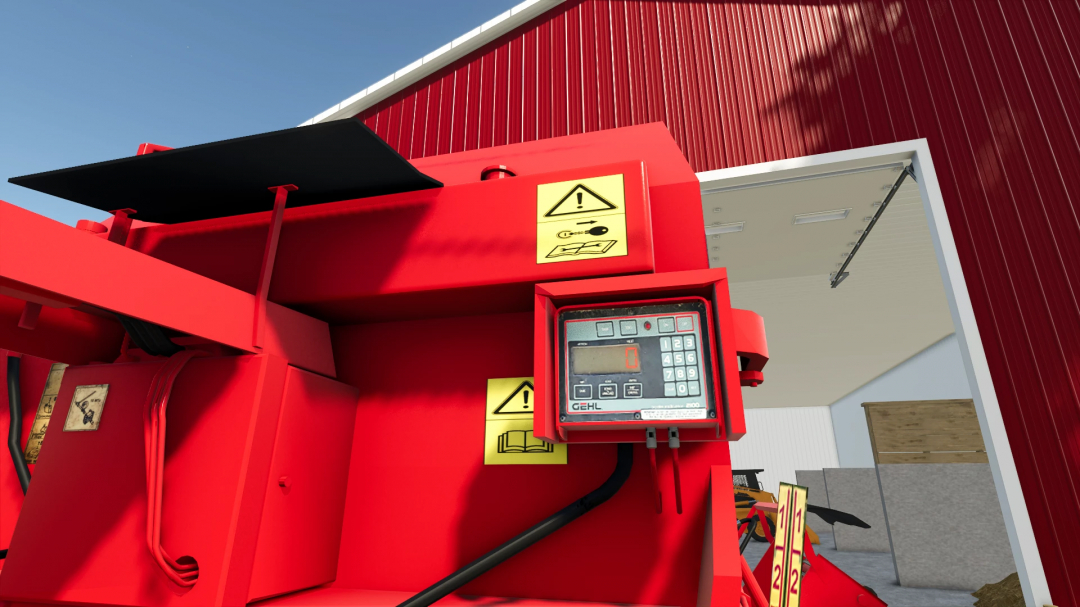 Close-up view of the Gehl Mixing Wagon FS25 mod with control panel, warning labels, and part of the red farming equipment, in Farming Simulator 25.