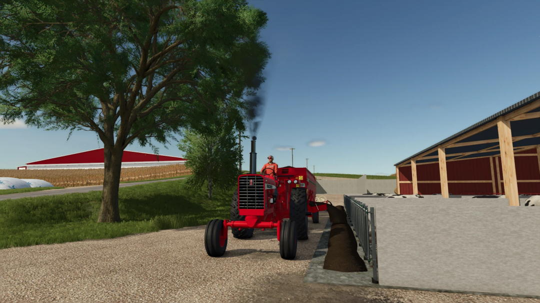 Farming Simulator 25 mod showing a red tractor near a barn with a man driving, with trees, farmland, and a blue sky in the background.