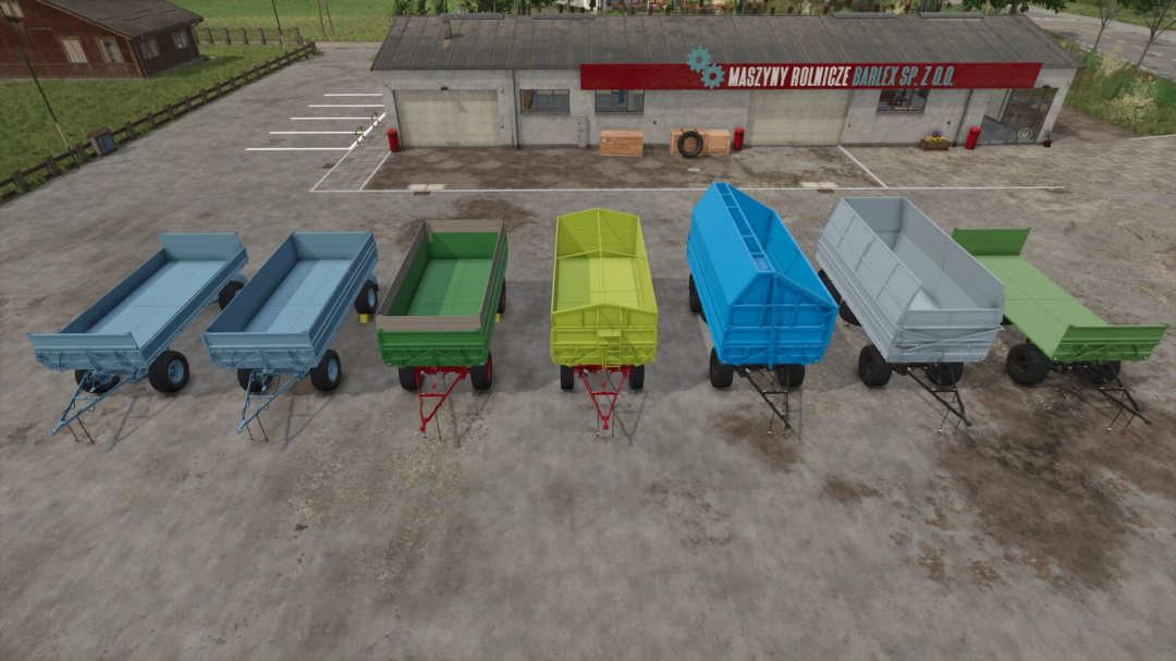 Six colored farming trailers displayed outside a barn in Farming Simulator 25 with the HW80 Trailer mod.