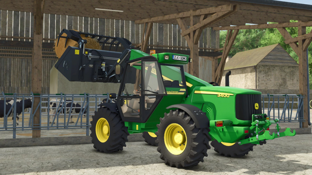 Farming Simulator 25 mod: John Deere 3400 Pack v1.0.0.0 tractor on a farm with a hay grabber attachment, in a barn setting.