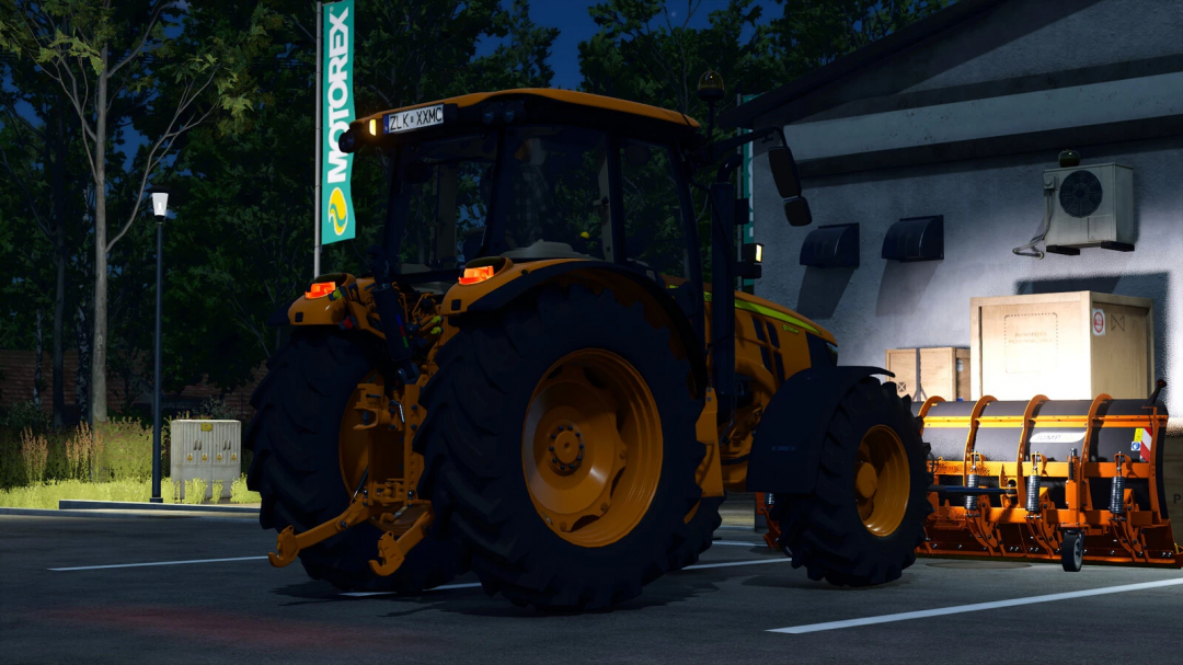 Farming Simulator 25 mod image of a John Deere 5M Series tractor with attached farming equipment, parked near a building at night.
