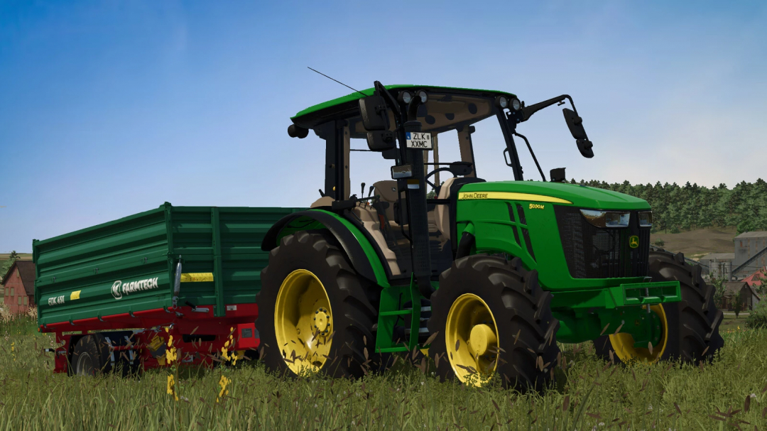 Farming Simulator 25 mod: John Deere 5M Series tractor with Farmtech trailer, realistic farming equipment, gameplay screenshot.