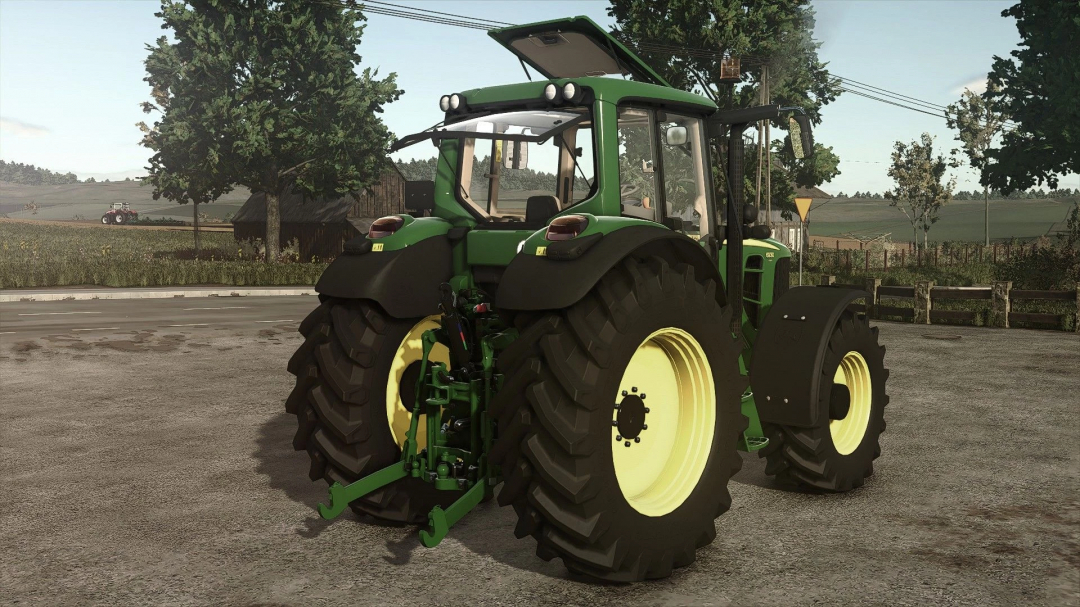 John Deere 6930 tractor mod from Farming Simulator 25, shown on a farm with green fields in the background, perfect for FS25 mods.